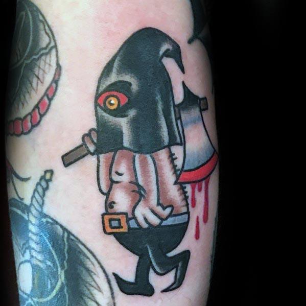 Cartoon-style executioner tattoo with a hooded figure carrying a bloodied axe, featuring bold outlines, shading, and a sinister red eye.