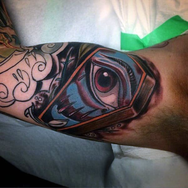 Guys Eye Coffin Tattoo Design On Bicep