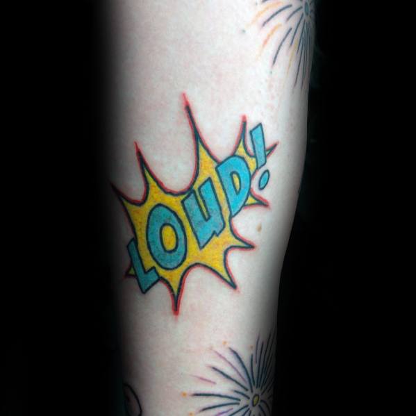 Tattoo of a comic-style explosion with the word "LOUD!" in bold blue and yellow, surrounded by firework bursts for a dynamic and energetic look.