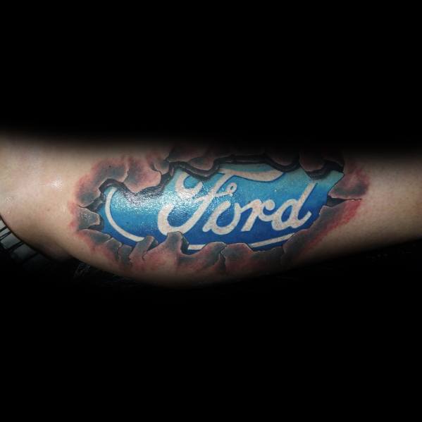 Ford logo tattoo on forearm with a ripped-skin effect, featuring a bold blue emblem and realistic torn flesh detailing for a striking 3D look.