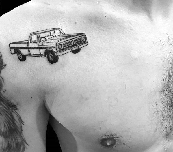 Minimalist black and grey Ford pickup truck tattoo on the upper chest, featuring clean linework and a classic vintage truck design.