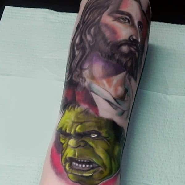 Guys Forearms Hulk And Religion Tattoo