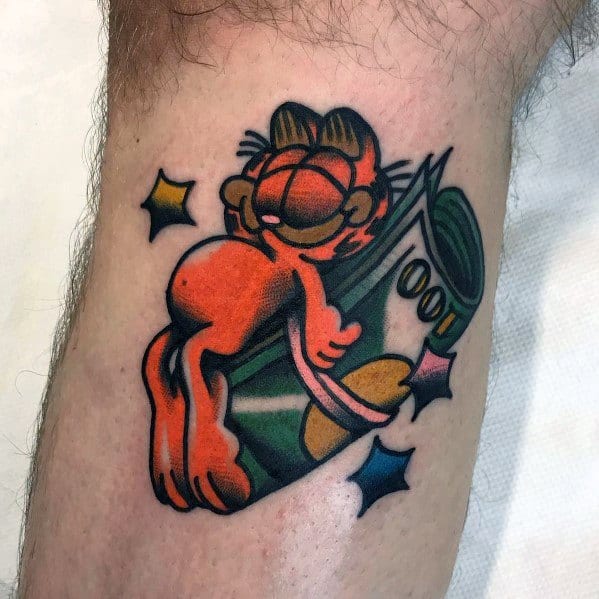 Garfield tattoo lounging on a stack of cash with a smug grin—bold colors and playful design for a fun, money-loving vibe.