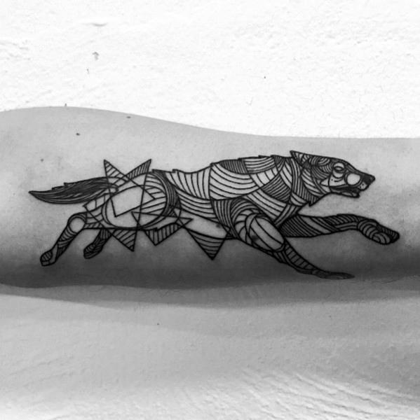 Geometric running wolf tattoo with bold line patterns and abstract shapes, capturing motion and energy across the forearm.