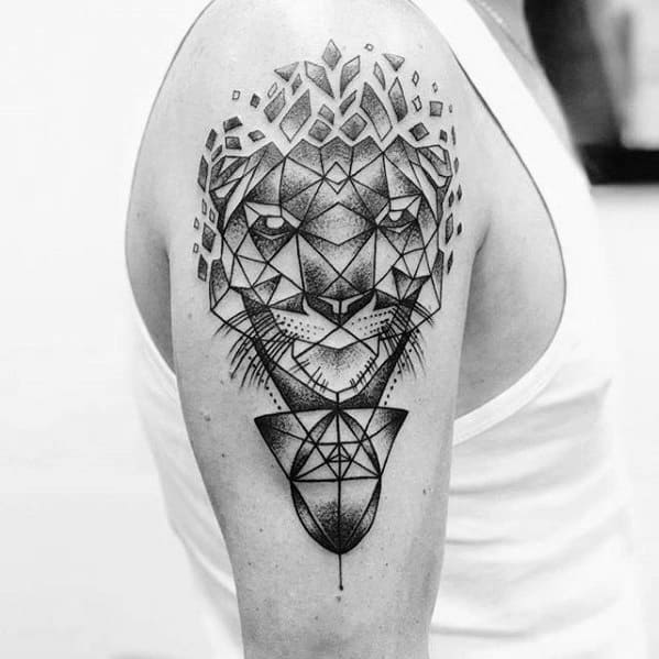 Geometric tiger tattoo on upper arm with dotwork shading, fragmented crown-like shapes, and symmetrical abstract elements.