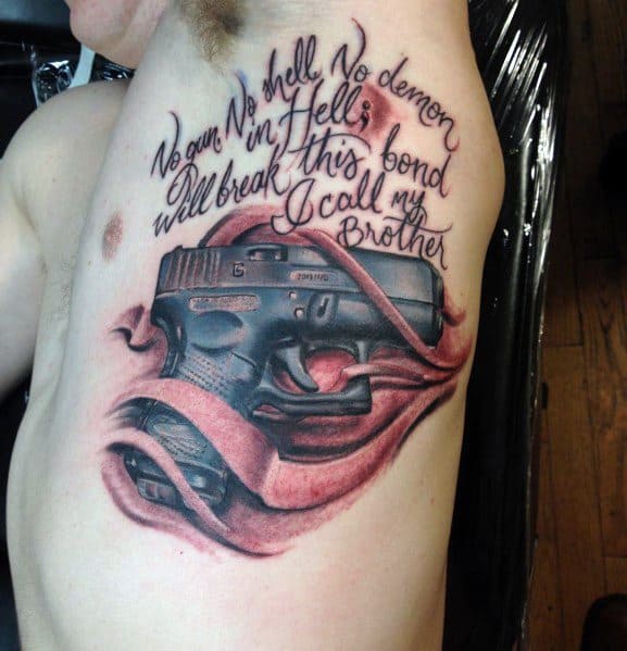 Realistic tattoo of a Glock pistol on the chest, wrapped in flowing fabric, with script above reading, "No gun, no shell, no demon in Hell..."