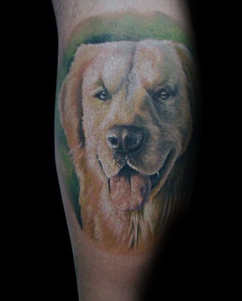Realistic Golden Retriever tattoo on the arm, featuring detailed fur shading, lifelike expression, and a soft green background for depth.