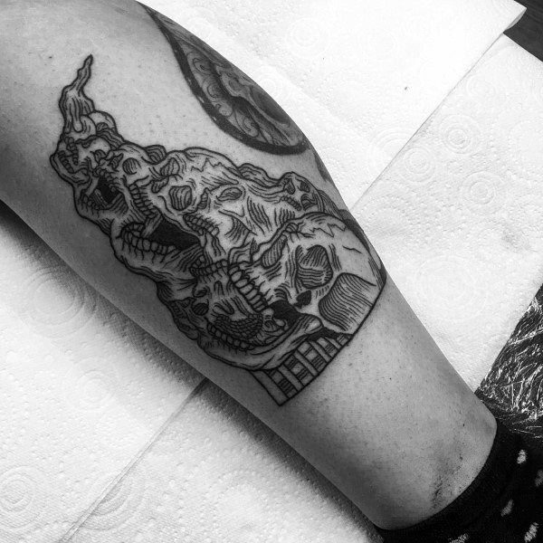 Black and grey tattoo featuring multiple melting skulls merging together, with bold linework and shading for a dark and gothic aesthetic.