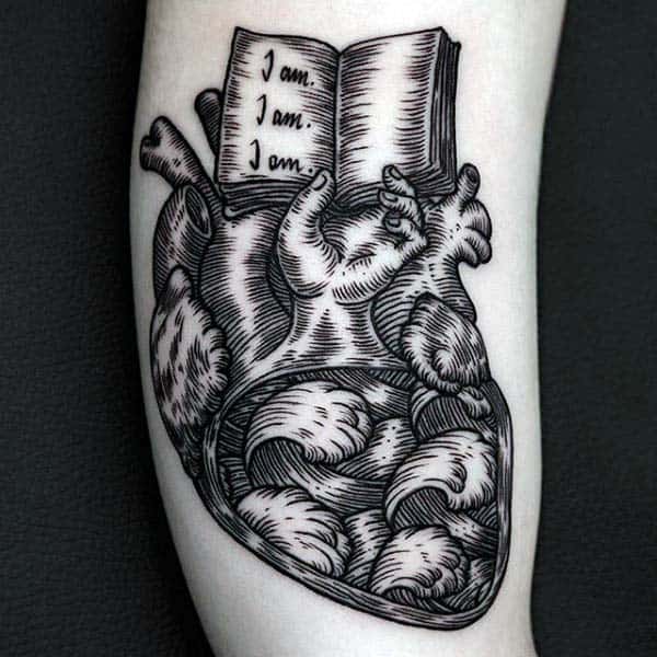 Guys Heart With Open Book Arm Woodcut Tattoo Designs