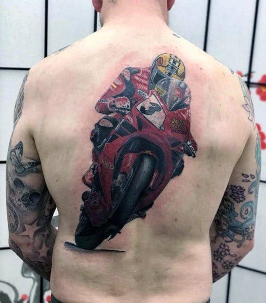 Realistic Honda sportbike tattoo on a man's back, featuring a racer in full gear riding a red motorcycle with intricate details and shading.