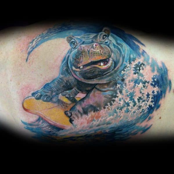 Guys Inner Arm Bicep Hippo On Surfboard With Waves Tattoos