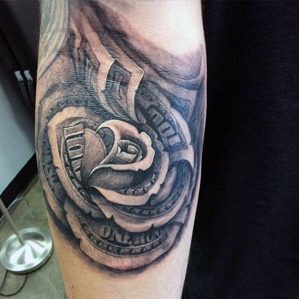 Tattoo of a rose made from rolled and folded hundred dollar bills on an arm