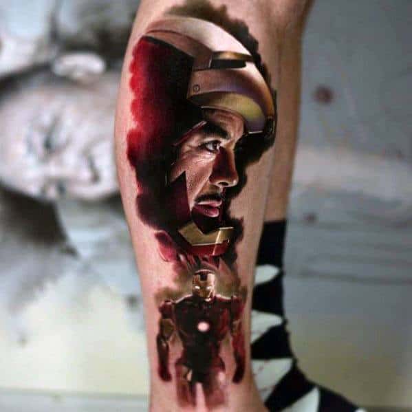 Iron Man tattoo featuring a dynamic composition with a portrait of Tony Stark's face merging with his Iron Man armor, creating a striking, colorful effect.