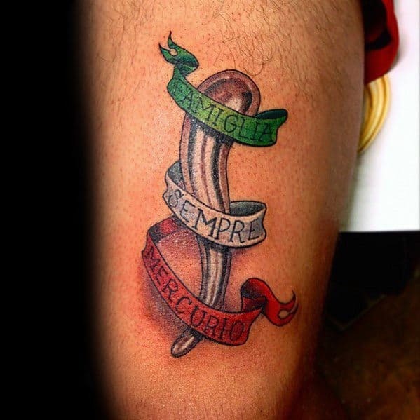 Italian horn tattoo with a tricolor ribbon reading 'Famiglia Sempre Mercurio,' symbolizing family, loyalty, and heritage.