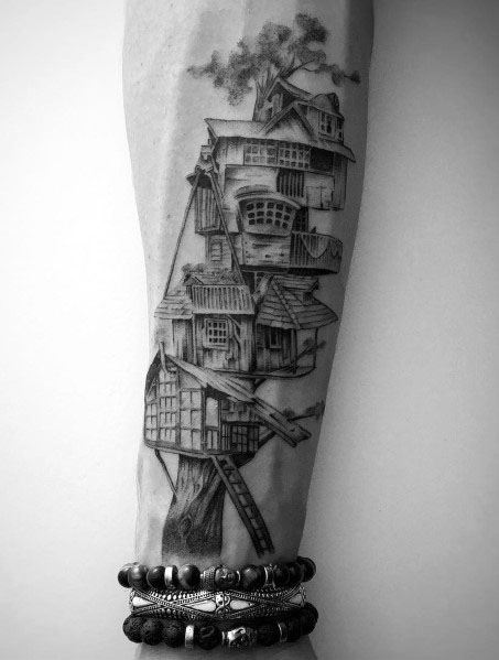 Intricate tattoo of a whimsical treehouse with a ladder, symbolizing adventure, ideal for men's forearms or detailed sleeve designs.