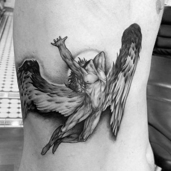 Detailed side torso tattoo of the winged Icarus figure with arms raised and dramatic shading, inspired by Led Zeppelin’s Swan Song logo.