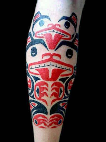 Guys Legs Red Black Haida Tattoo