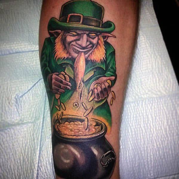 Tattoo of a sly-looking leprechaun in green, dropping gold coins into a pot, with a glowing effect and mischievous expression.