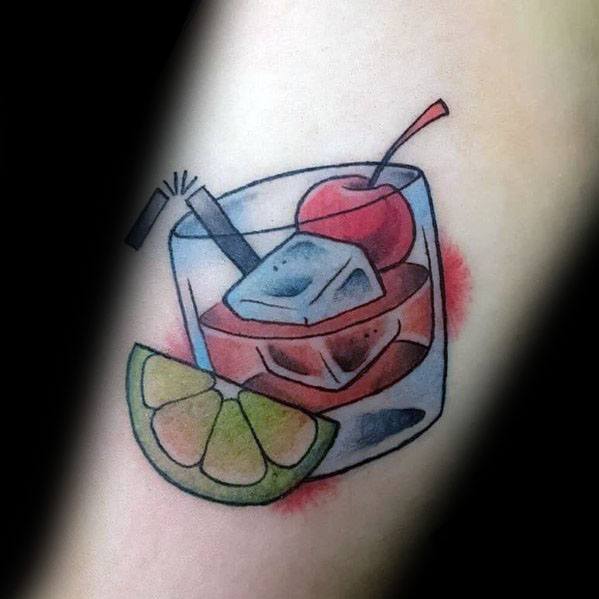 Classic cocktail tattoo featuring a glass of whiskey with ice, a cherry garnish, and a lime wedge, blending a stylish and refreshing design.