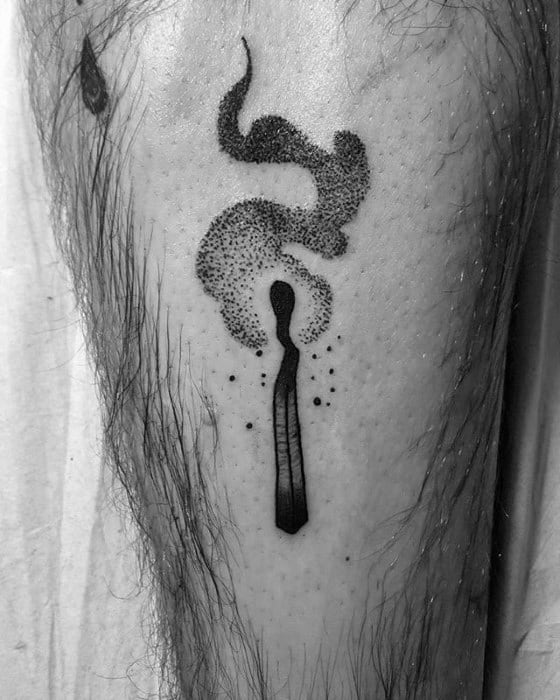 Blackwork matchstick tattoo with dotted smoke detail, blending realism and dotwork to represent energy release or fading intensity.