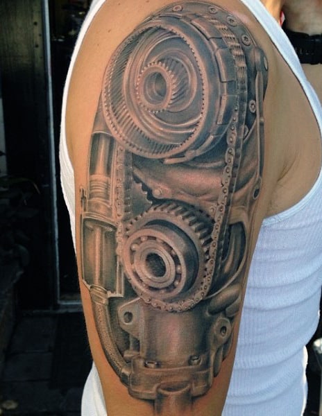 Detailed mechanical gears tattoo on an upper arm