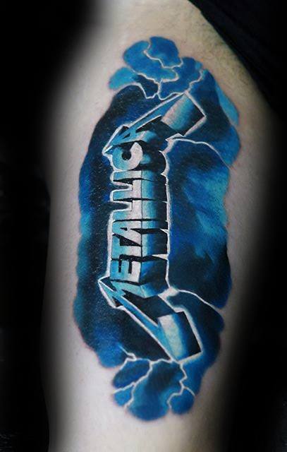 Vibrant blue and black tattoo of the Metallica logo bursting through the skin with a cracked, electrified effect.