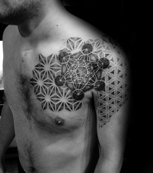 Shoulder and chest tattoo featuring Metatron’s Cube with dotwork shading, layered over the Flower of Life pattern for a bold geometric fusion.