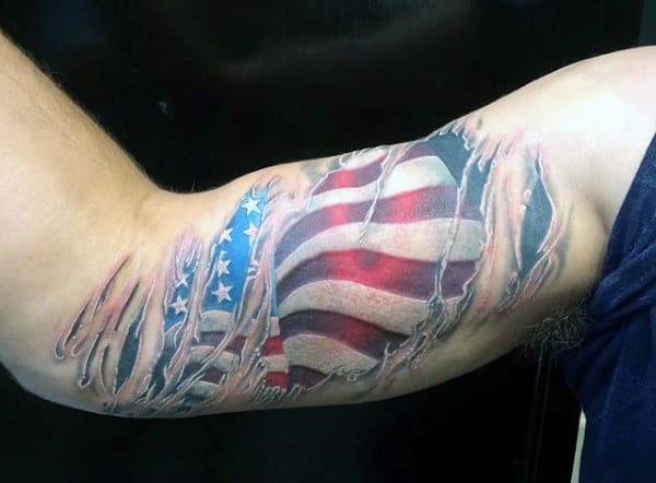 Guy's Military Flag Tattoo On Bicep