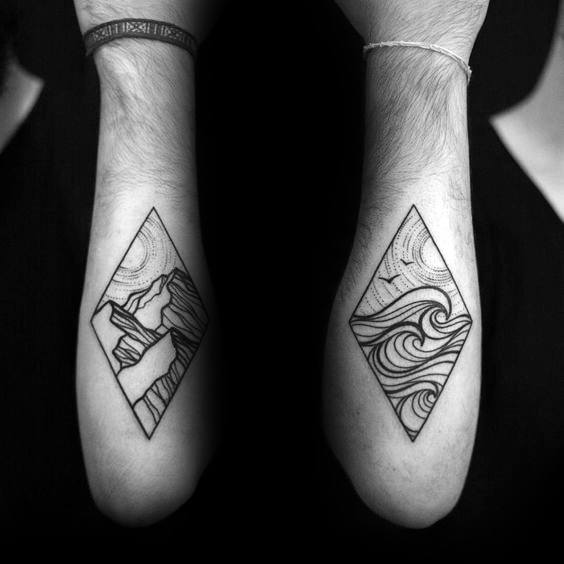 Matching forearm tattoos featuring geometric mountain and wave designs in diamond frames, using fine linework for a bold yet minimalist look.