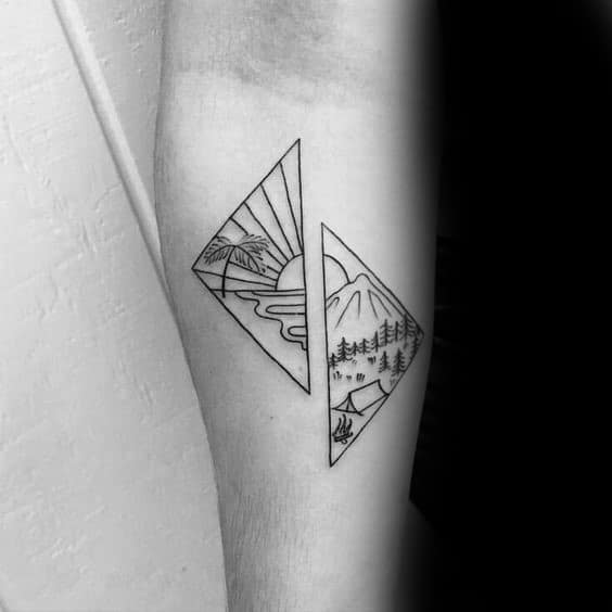 Minimalist black ink tattoo featuring a split diamond design with mountains, trees, a river, and a rising sun, creating a balanced nature scene.
