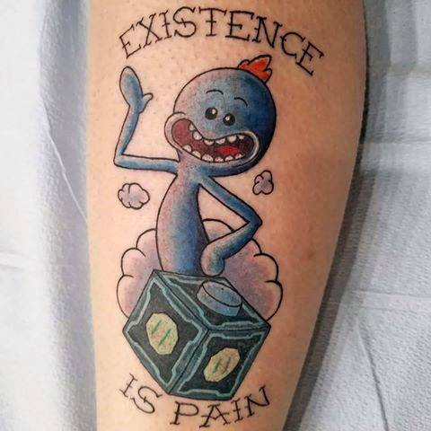 Tattoo of Mr. Meeseeks from Rick and Morty standing on a Meeseeks Box, with 'Existence is Pain' written above and below.