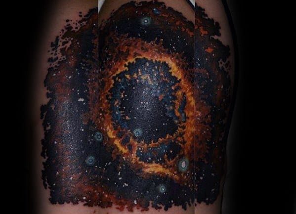 A vivid Nebula Tattoo sprawls across the shoulder and upper arm