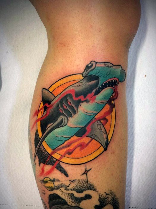 Neo-traditional hammerhead shark tattoo with red lightning, bold outlines, and a retro-style orange sun in the background.