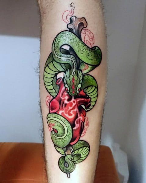 Neo-traditional tattoo of a green snake wrapped around a realistic red heart, with intricate shading and bold colors creating a striking design.