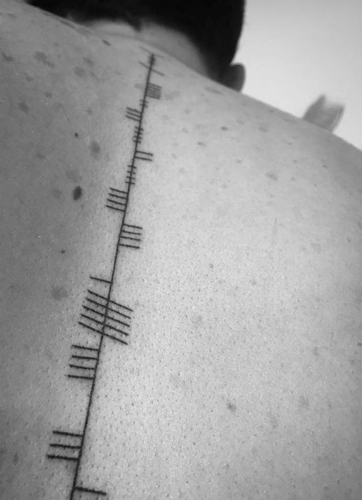 Guys Ogham Tattoo Deisgns On Spine