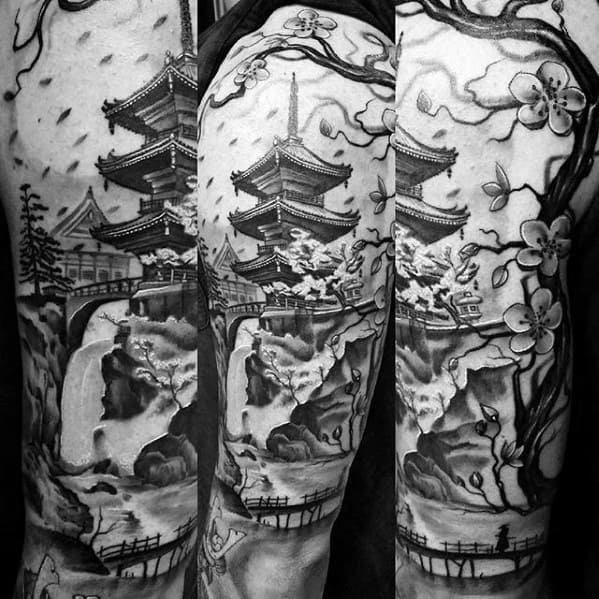 Full-sleeve black and grey tattoo of a Japanese pagoda on a cliff with a waterfall, cherry blossoms, and traditional scenic elements.