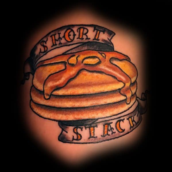 Traditional-style pancake tattoo with syrup and butter, featuring a banner that reads "Short Stack" for a playful and nostalgic design.