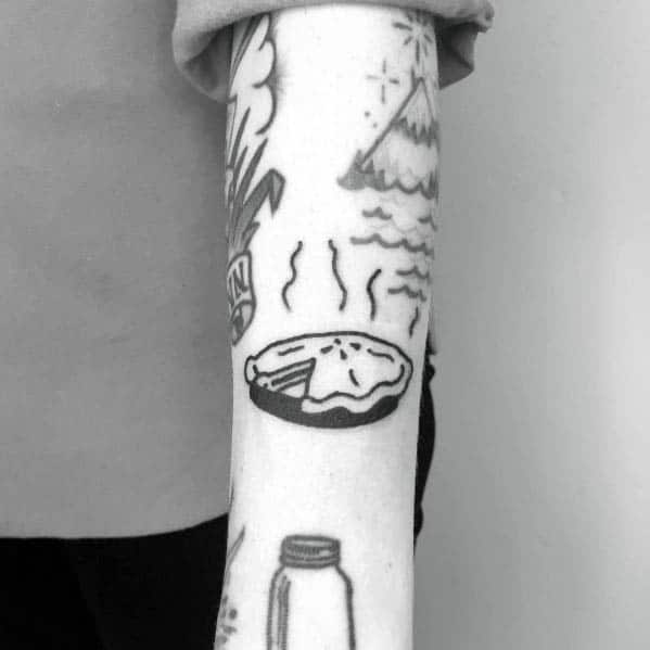 Black and white steaming pie tattoo with a missing slice, featuring a simple, classic design with a nostalgic and minimalist touch