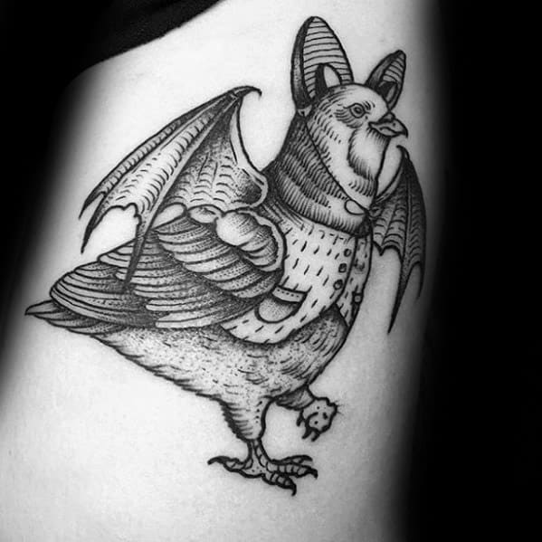 Black ink tattoo of a pigeon with bat wings and vampire fangs, blending gothic and surreal elements in a unique fantasy style.