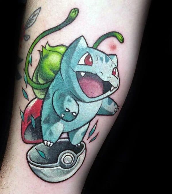 Vibrant Bulbasaur tattoo leaping from an open Pokeball with dynamic lines and bright colors for an energetic, playful design.
