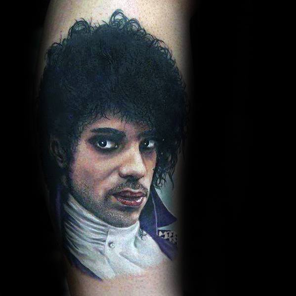 A lifelike portrait tattoo of Prince in vibrant colors, capturing his charismatic expression and iconic style