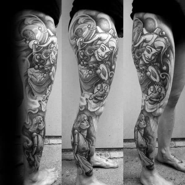 Black and grey puppet tattoo sleeve featuring a jester-like figure controlling a female marionette, symbolizing illusion and manipulation.