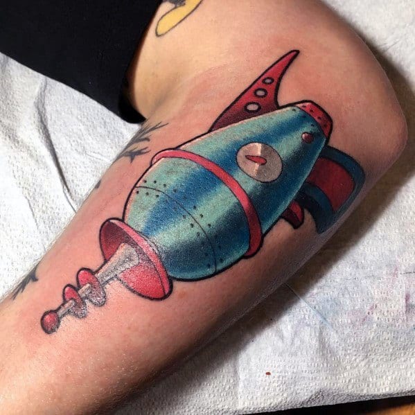 Colorful retro ray gun tattoo with a vintage sci-fi aesthetic, featuring bold shading, metallic blue tones, and classic space-age details.