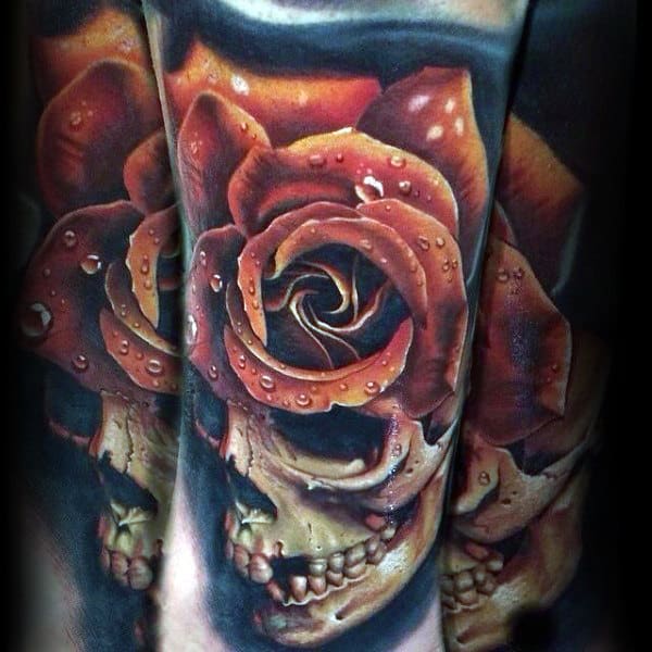 Tattoo of a skull blended with a rose, detailed with water droplets