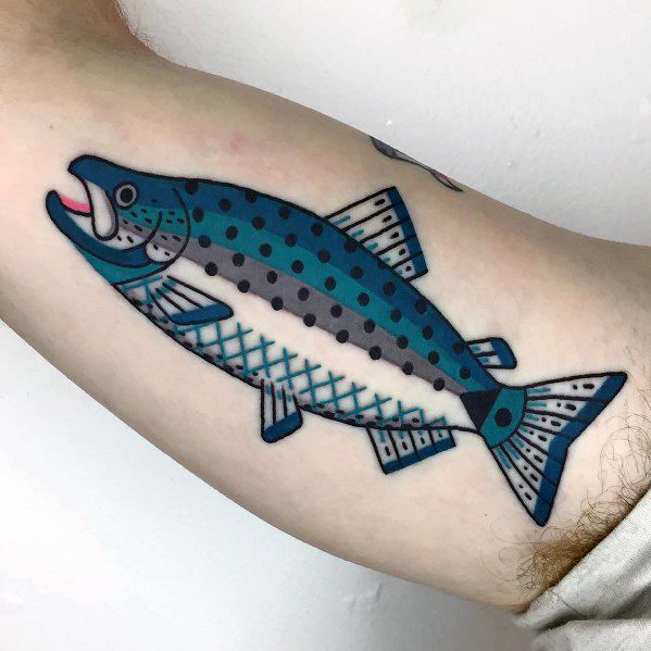 Bold geometric salmon tattoo with blue and black patterns, featuring a stylized design on the arm for a modern and artistic look.
