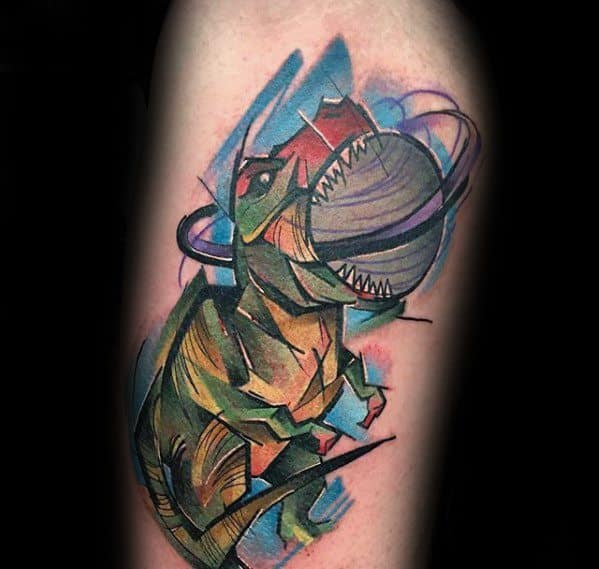Colorful Saturn tattoo design for men featuring a roaring T-Rex with the ringed planet inside its mouth in a bold abstract style.