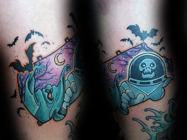 Tattoo of the Scooby-Doo space ghost villain in an astronaut suit, surrounded by bats, moons, and a purple night sky.