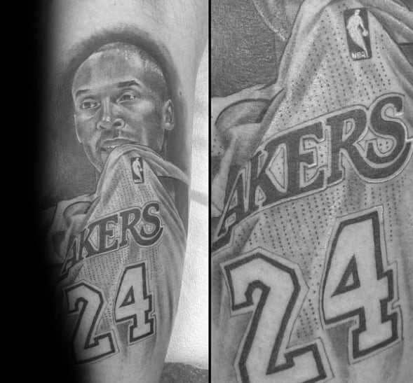 A black and white tattoo of Kobe Bryant, capturing his focused expression while wearing his Lakers jersey with the number 24, with fine details of the jersey's texture.