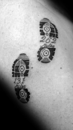Footprint tattoo with “13.1 miles” and “26.2 miles” inside the soles, marking the path of a half and full marathon runner.