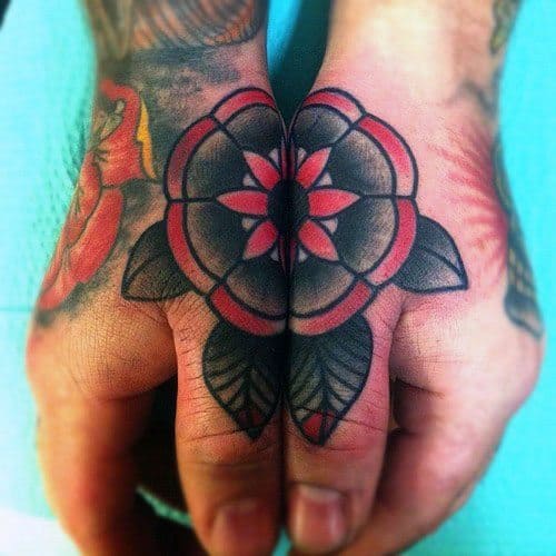 Matching side hand tattoos for men forming a bold red and black flower design when hands are placed together.